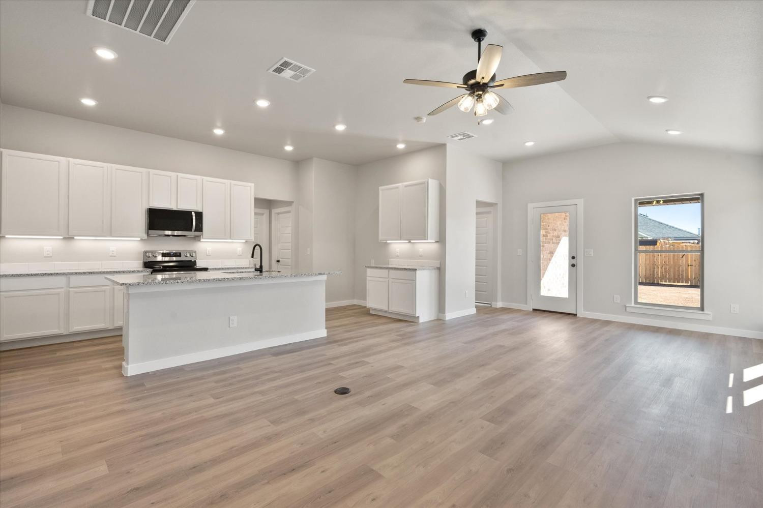 7429 30th Street Lubbock, TX 79407 - Photo 3 of 20 a view of kitchen with sink and refrigerator