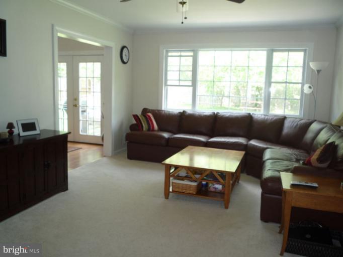 17221 Chiswell Road Poolesville, MD 20837 - Photo 2 of 23 a living room with furniture and a window