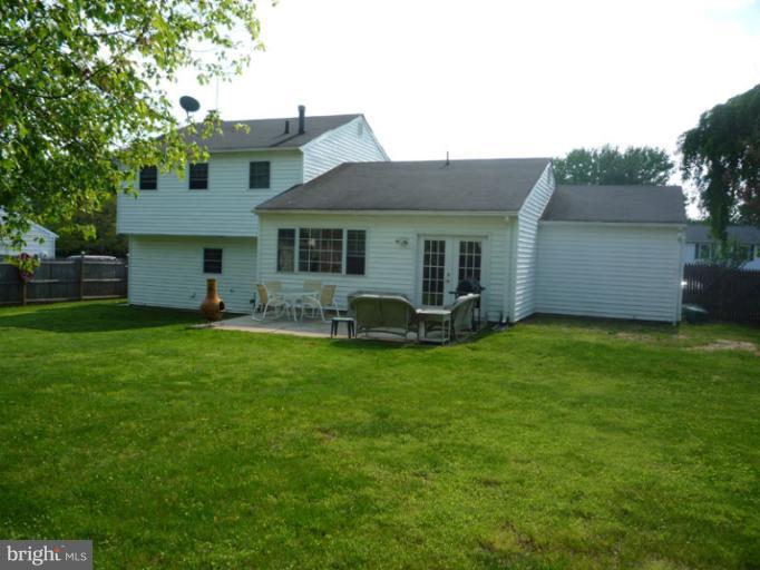 17221 Chiswell Road Poolesville, MD 20837 - Photo 18 of 23 a front view of house with yard and outdoor seating