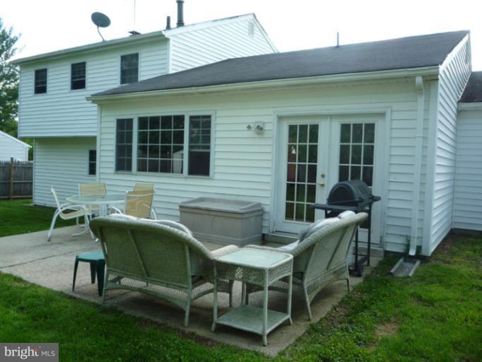 17221 Chiswell Road Poolesville, MD 20837 - Photo 20 of 23 a view of a house with a backyard and sitting area