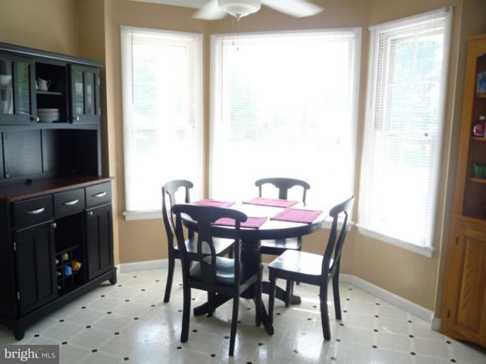 17221 Chiswell Road Poolesville, MD 20837 - Photo 4 of 23 a view of a dining room with furniture and window
