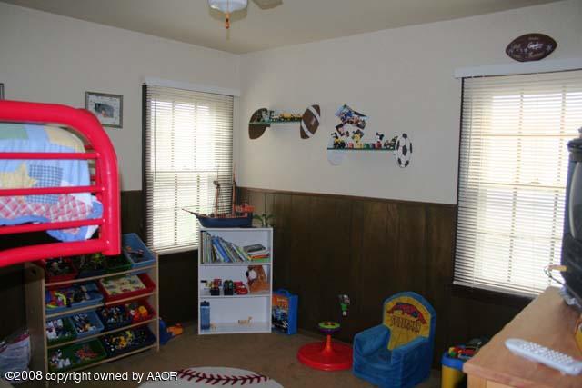3625 South Travis Street Amarillo, TX 79110 - Photo 6 of 9 a view of a workspace with furniture and a window
