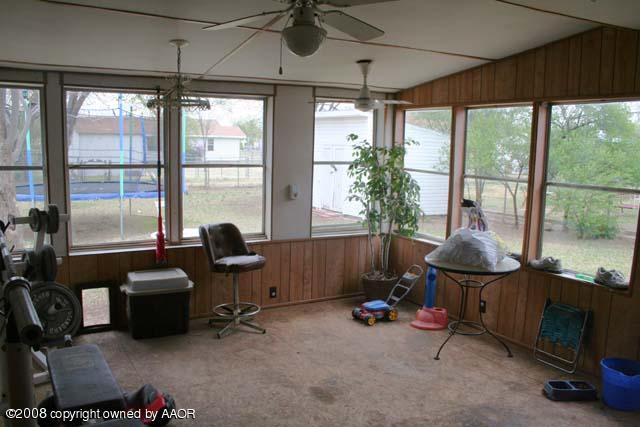 3625 South Travis Street Amarillo, TX 79110 - Photo 8 of 9 a room with furniture and windows