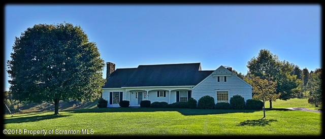 1345 Phillips Road Springville, PA 18844 - Photo 1 of 54 a front view of a house with a yard