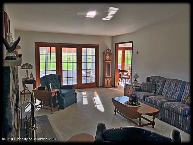 1345 Phillips Road Springville, PA 18844 - Photo 17 of 54 a living room with furniture and a large window