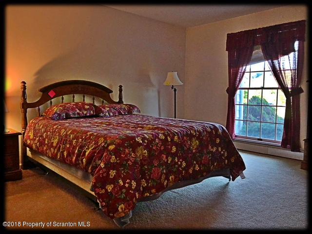1345 Phillips Road Springville, PA 18844 - Photo 22 of 54 a bedroom with a bed and window