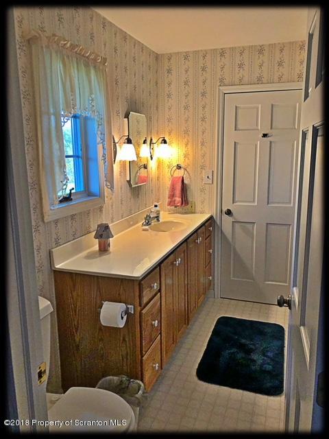 1345 Phillips Road Springville, PA 18844 - Photo 24 of 54 a bathroom with a sink and a mirror
