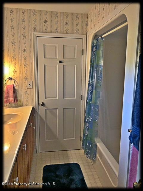 1345 Phillips Road Springville, PA 18844 - Photo 25 of 54 a bathroom with a tub shower vanity and a sink
