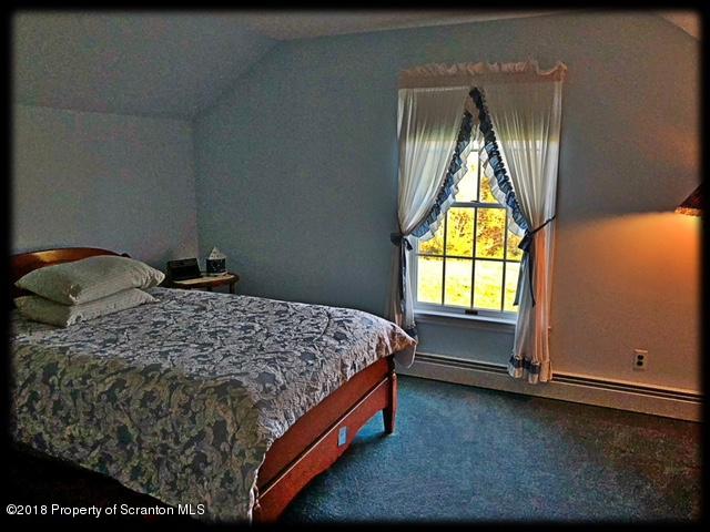 1345 Phillips Road Springville, PA 18844 - Photo 28 of 54 a bedroom with a bed and window