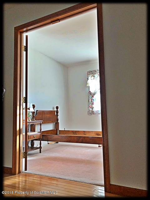 1345 Phillips Road Springville, PA 18844 - Photo 29 of 54 a view of a hallway with wooden floor and furniture