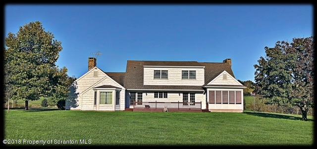 1345 Phillips Road Springville, PA 18844 - Photo 3 of 54 a front view of a house with a garden