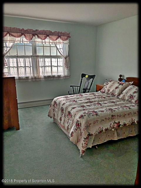 1345 Phillips Road Springville, PA 18844 - Photo 32 of 54 a bedroom with a bed and window