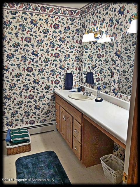 1345 Phillips Road Springville, PA 18844 - Photo 33 of 54 a bathroom with a sink and a mirror