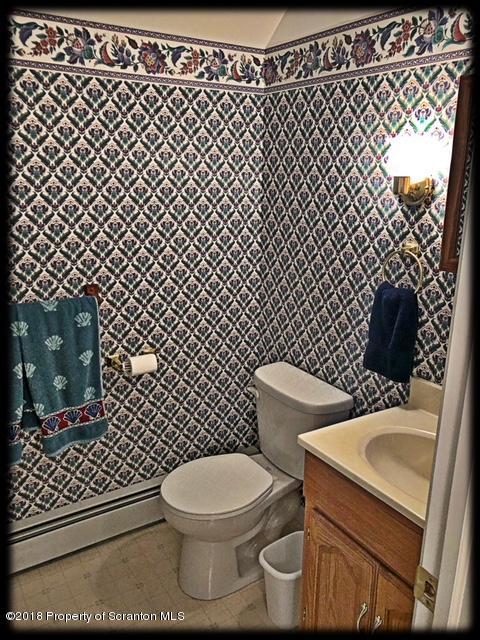 1345 Phillips Road Springville, PA 18844 - Photo 35 of 54 a white toilet sitting next to a shower curtain