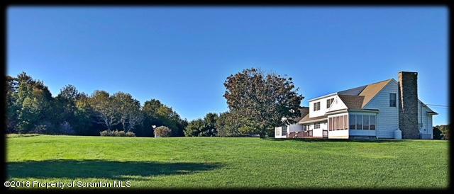 1345 Phillips Road Springville, PA 18844 - Photo 42 of 54 a view of a big house with a big yard and large trees