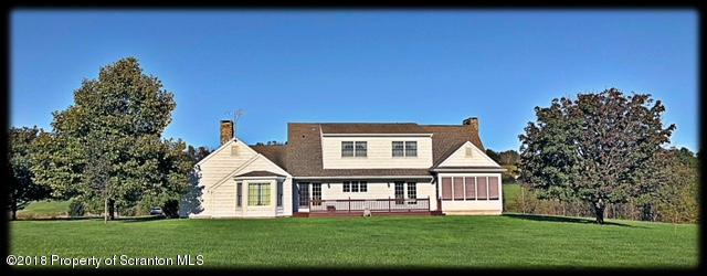 1345 Phillips Road Springville, PA 18844 - Photo 44 of 54 a front view of a house with a garden