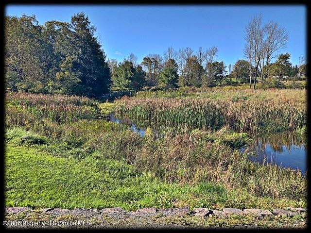 1345 Phillips Road Springville, PA 18844 - Photo 51 of 54 a view of a lake with a mountain in the background