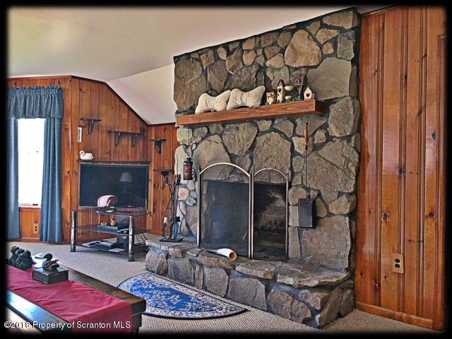 1345 Phillips Road Springville, PA 18844 - Photo 8 of 54 a living room with furniture and a painting on the wall