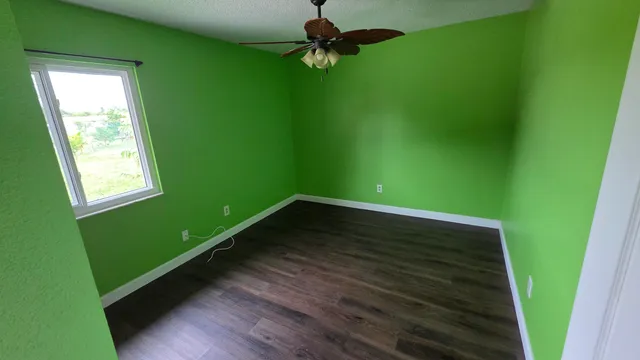 a view of room with window and hardwood