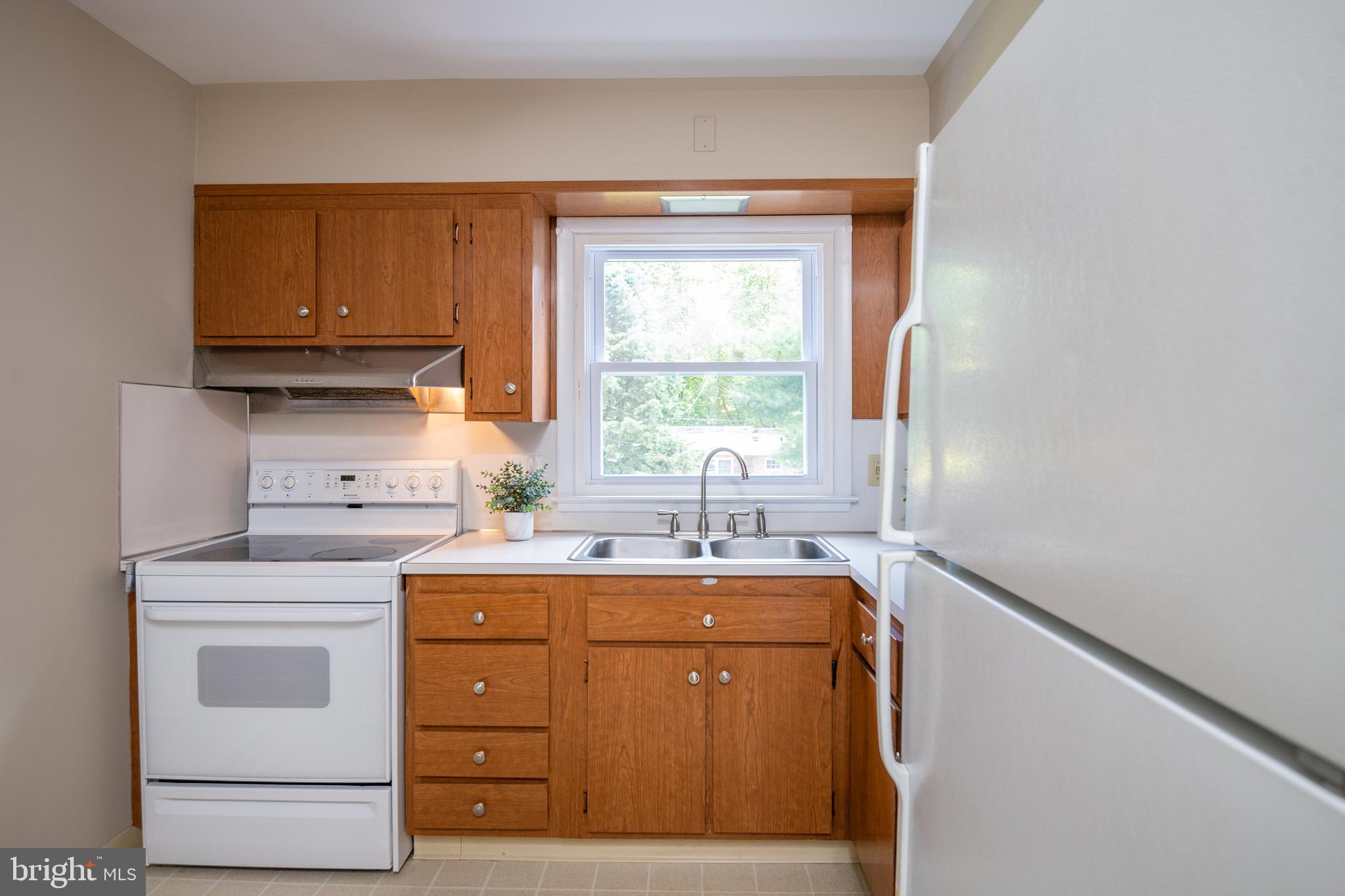 345 Sunset Road West Reading, PA 19611 - Photo 13 of 29 a kitchen with a stove and a sink
