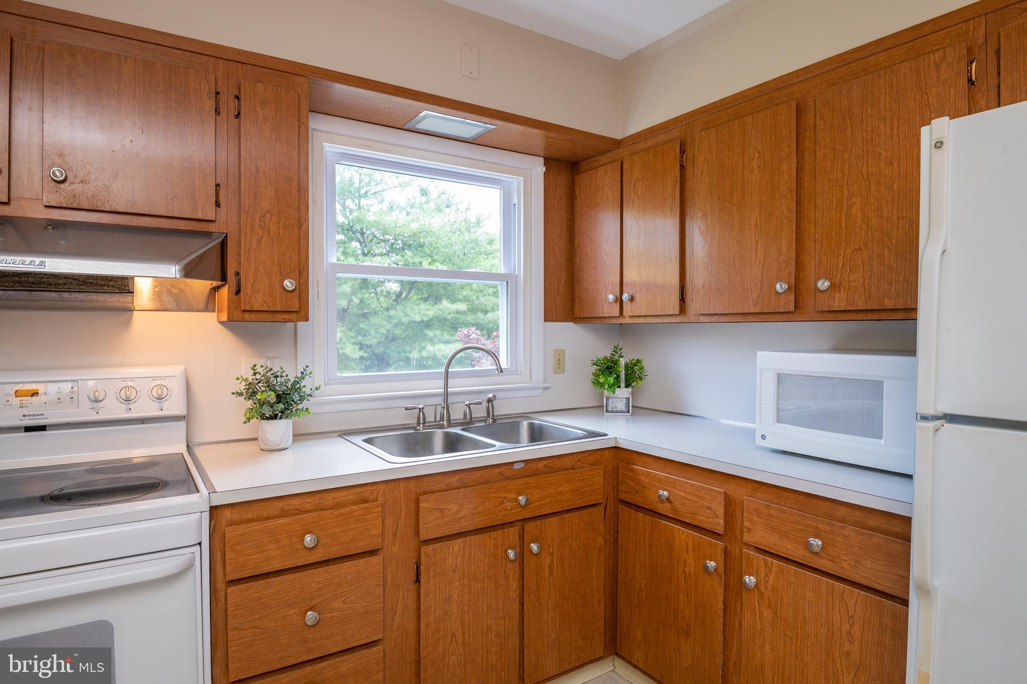 345 Sunset Road West Reading, PA 19611 - Photo 14 of 29 a kitchen with a sink cabinets and window