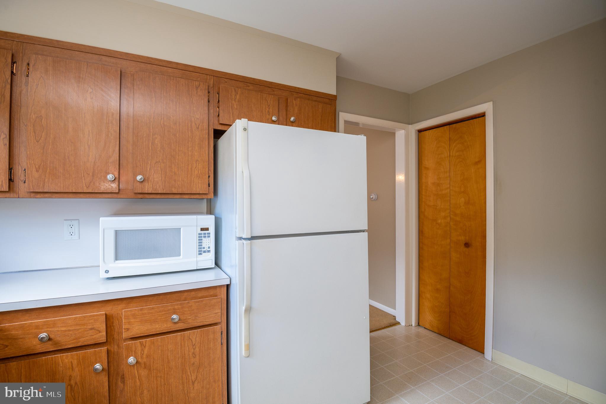 345 Sunset Road West Reading, PA 19611 - Photo 15 of 29 a white refrigerator freezer sitting in a kitchen