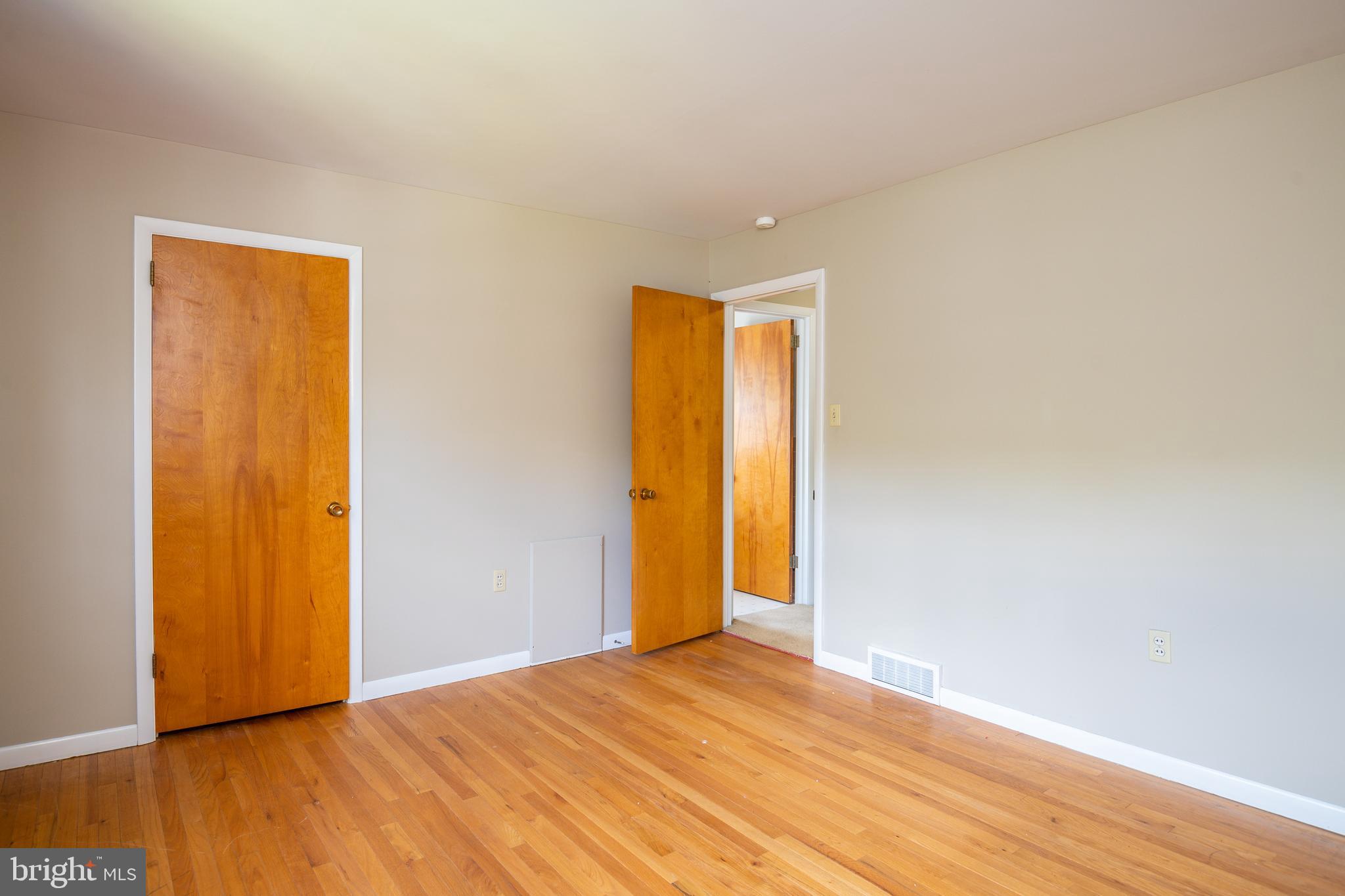 345 Sunset Road West Reading, PA 19611 - Photo 18 of 29 a view of an empty room with wooden floor and closet