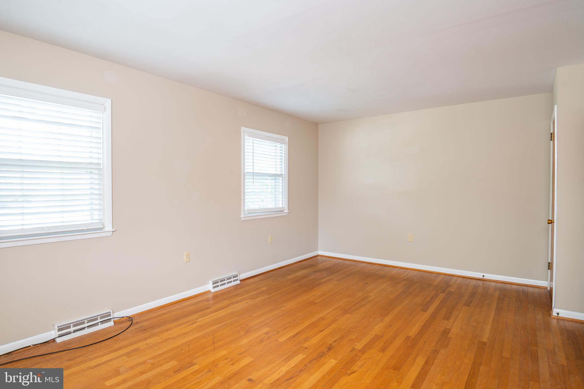 345 Sunset Road West Reading, PA 19611 - Photo 19 of 29 an empty room with wooden floor and windows