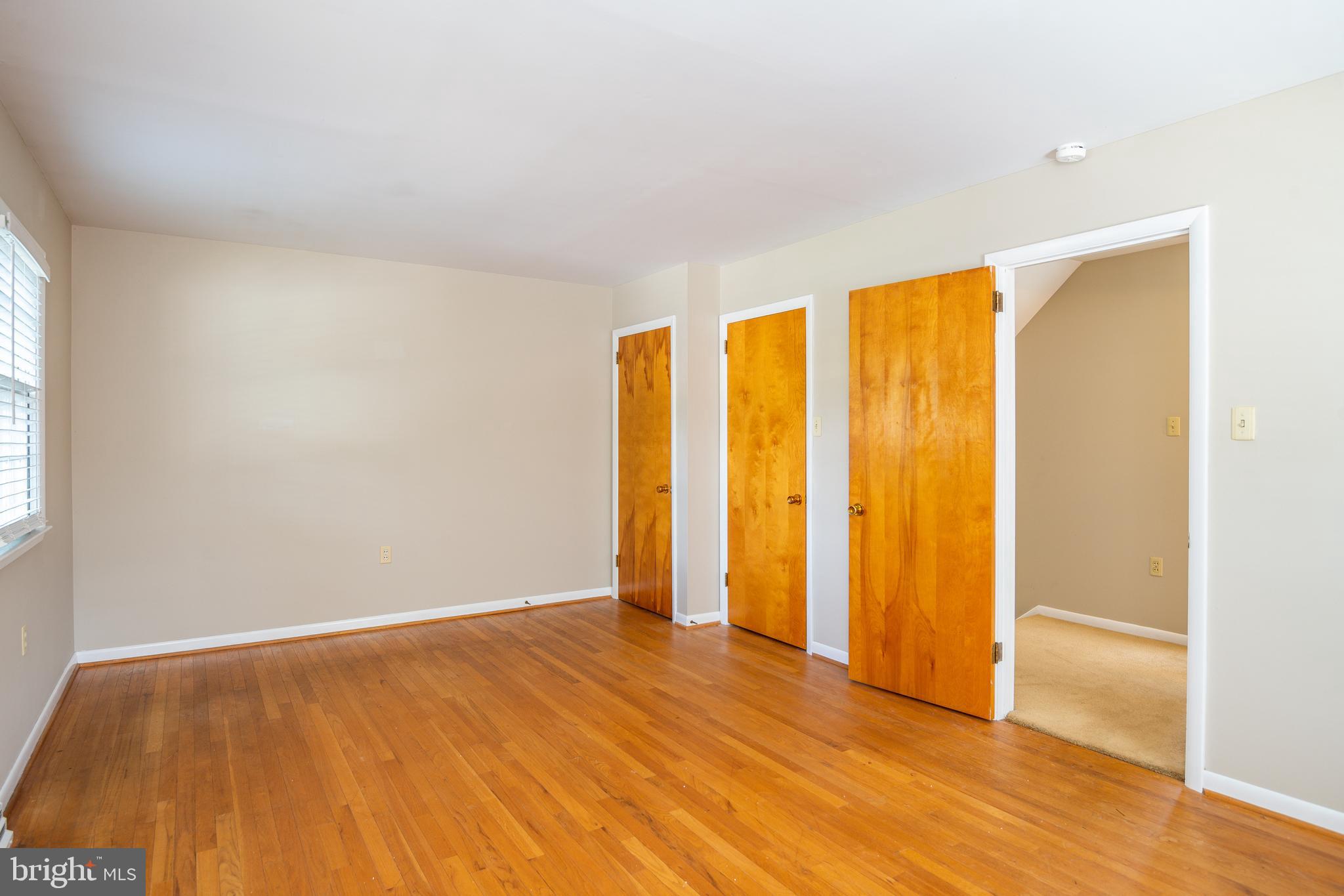 345 Sunset Road West Reading, PA 19611 - Photo 20 of 29 a view of an empty room with wooden floor and a window