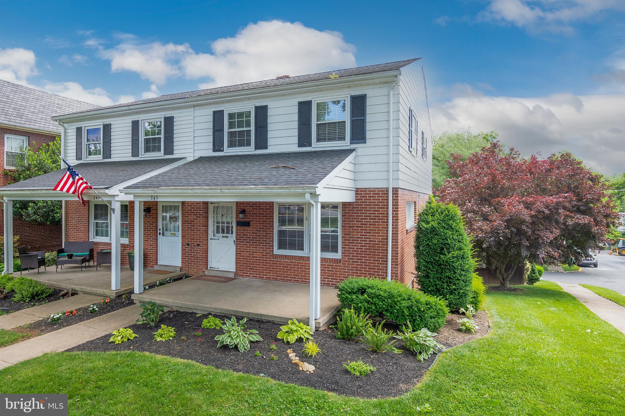 345 Sunset Road West Reading, PA 19611 - Photo 2 of 29 a front view of a house with a garden
