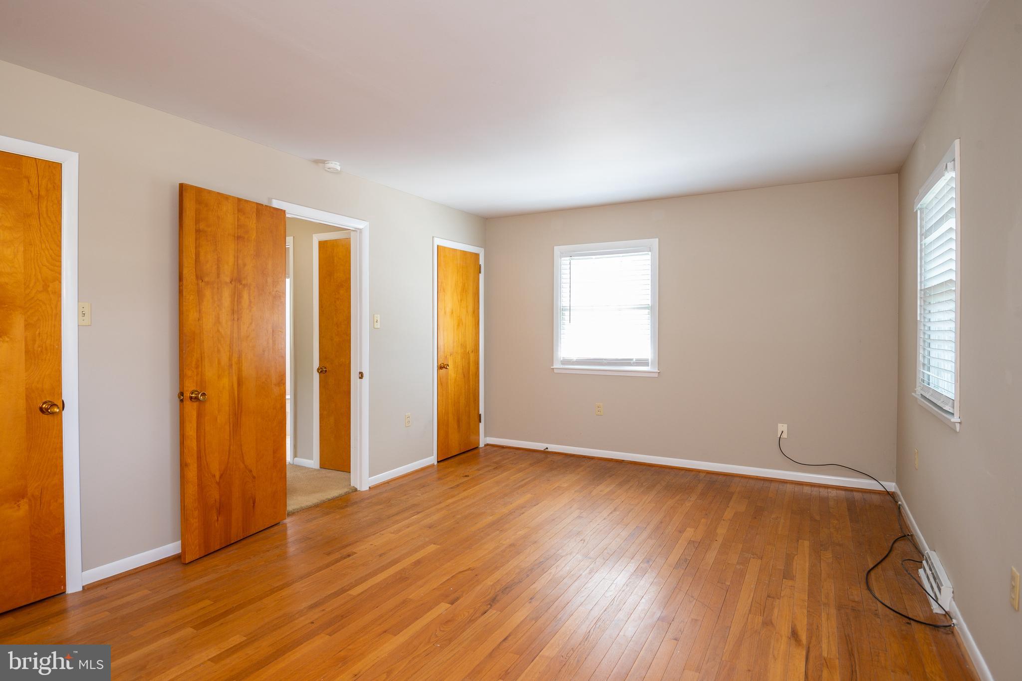 345 Sunset Road West Reading, PA 19611 - Photo 22 of 29 a view of an empty room with wooden floor and a window