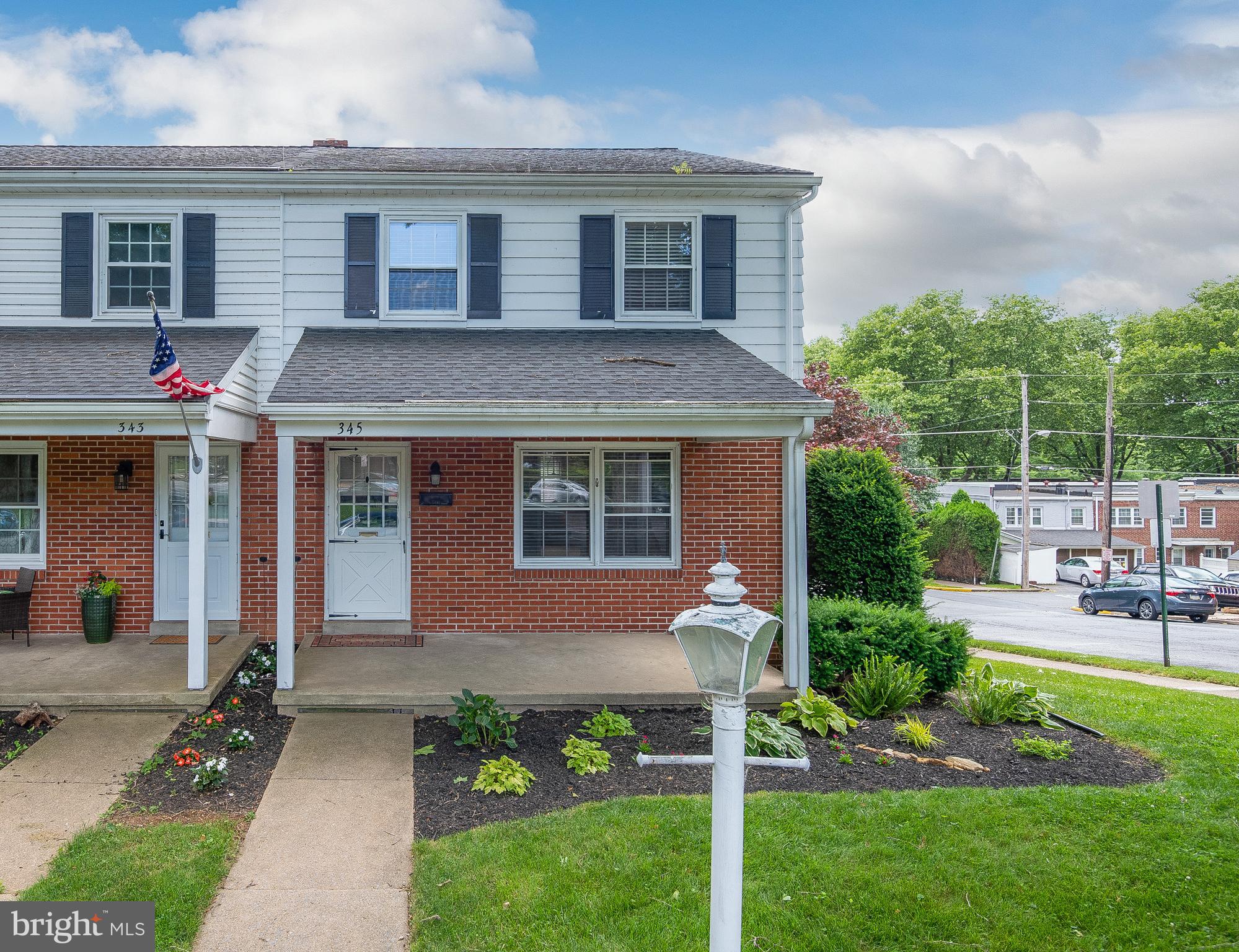 345 Sunset Road West Reading, PA 19611 - Photo 3 of 29 a front view of a house with a yard and porch