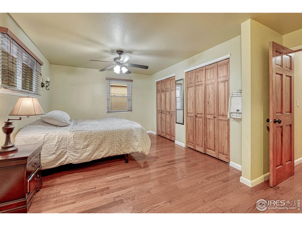 2518 Highland Road Greeley, CO 80634 - Photo 15 of 40 Primary Suite with double closets and hardwood floors.