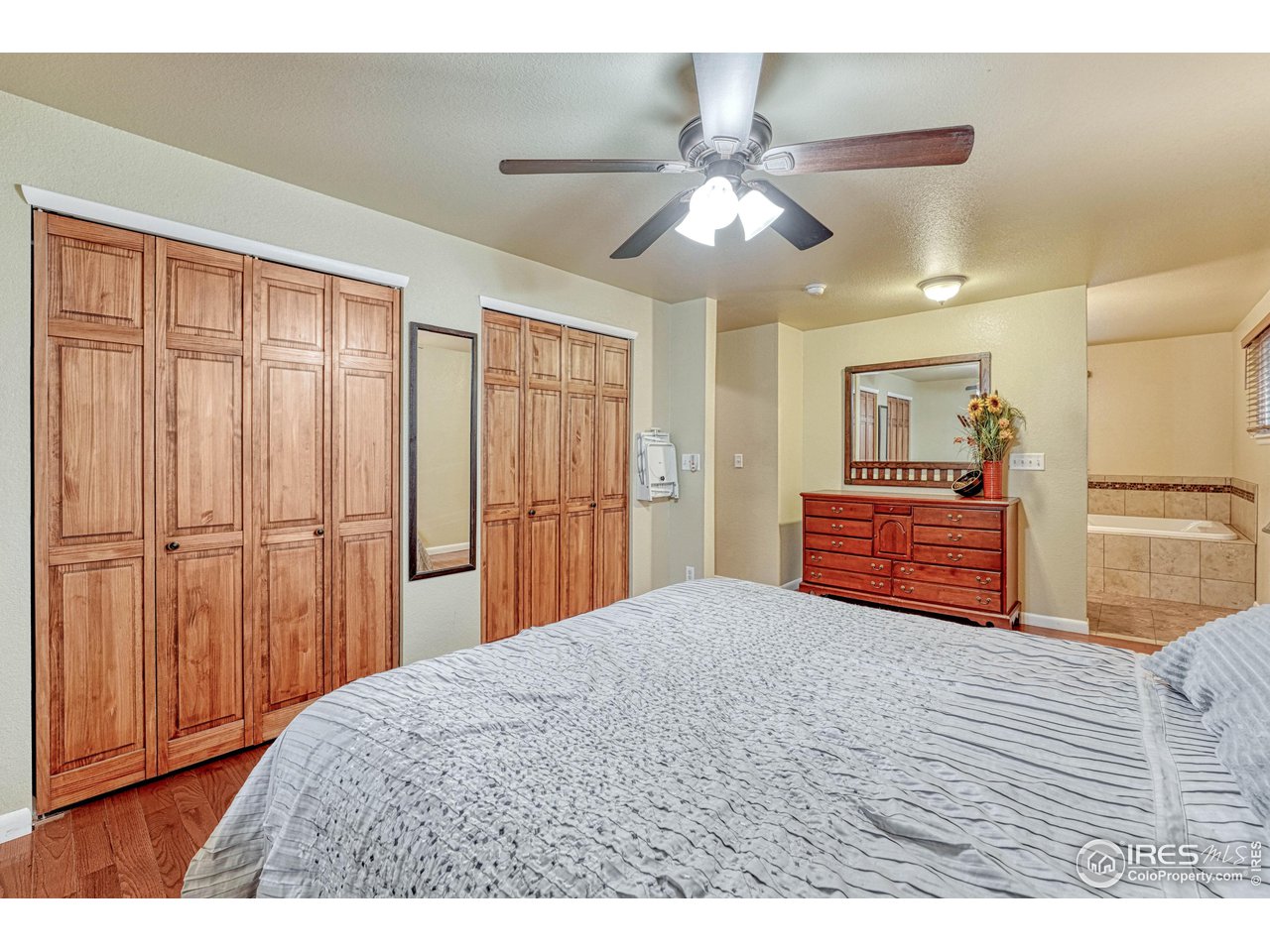 2518 Highland Road Greeley, CO 80634 - Photo 16 of 40 Primary bedroom leading to luxury primary 5pc bathroom