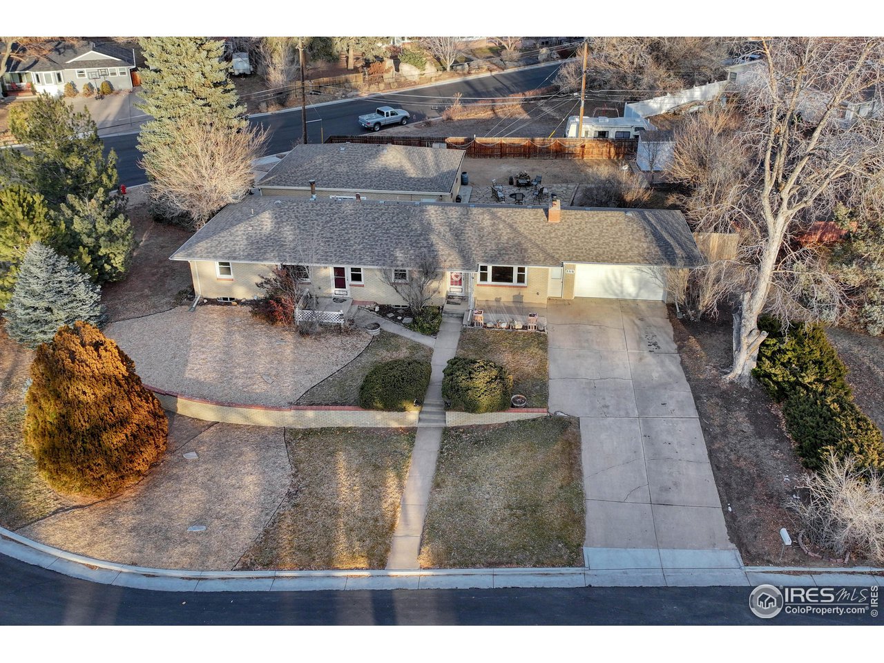 2 Car attached Garage with long driveway facing west.