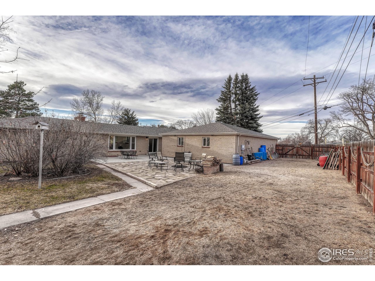 2518 Highland Road Greeley, CO 80634 - Photo 33 of 40 Backyard also offers gated area for Boat/RV Parking already setup with breeze (crushed granite sand) along east side of property. Fence is not property line as there is additional space to the east of the fence for parking.
