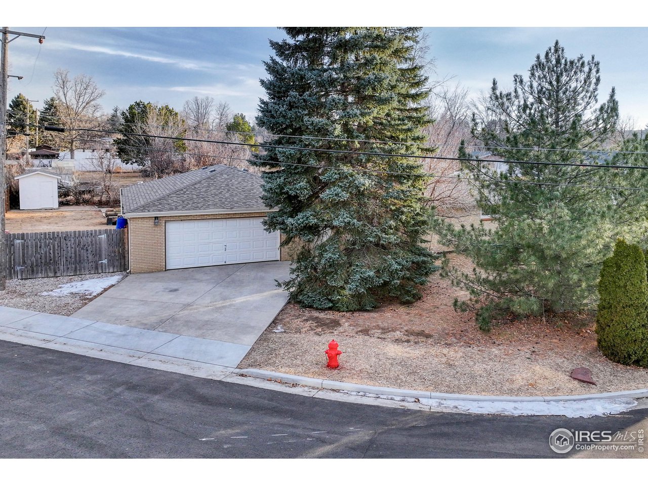 2518 Highland Road Greeley, CO 80634 - Photo 34 of 40 Shop and 2nd driveway with fire hydrant right at the property corner.