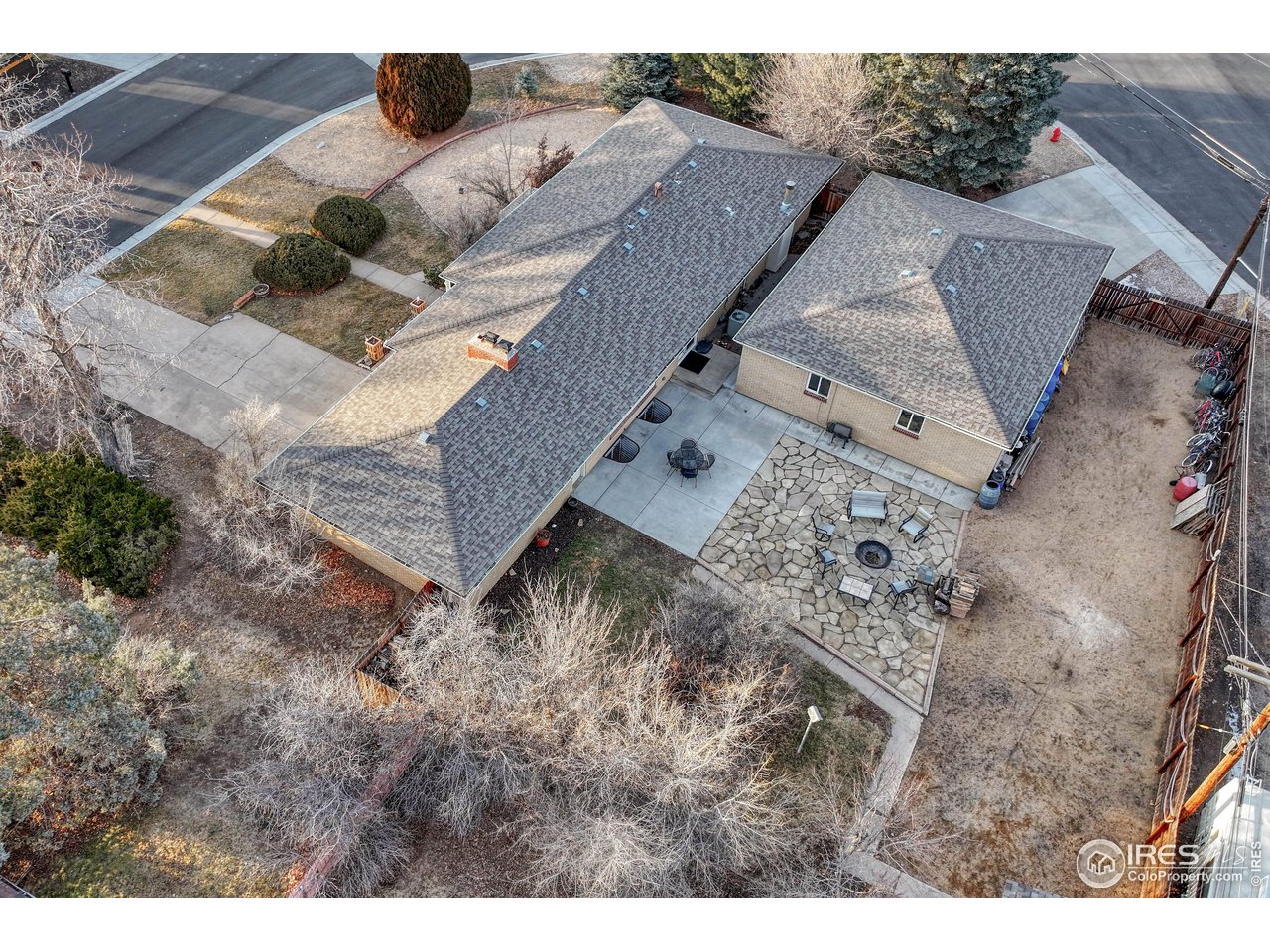 Flagstone patio with inset firepit in privacy fenced backyard AND RV/Boat parking to the rear of the property (both inside and outside of back fence).