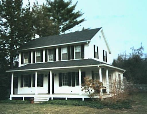 70 Great Hill Road Ridgefield, CT 06877 - Photo 1 of 1 a front view of a house with a garden