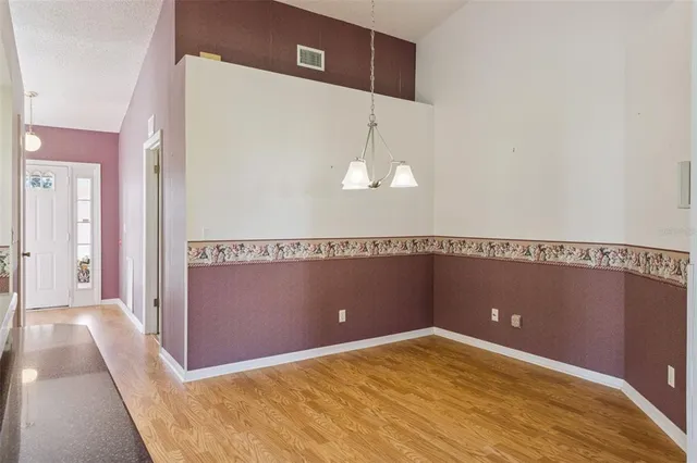 a view of empty room with windows