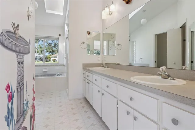 an aerial view of a house with a yard and lake view