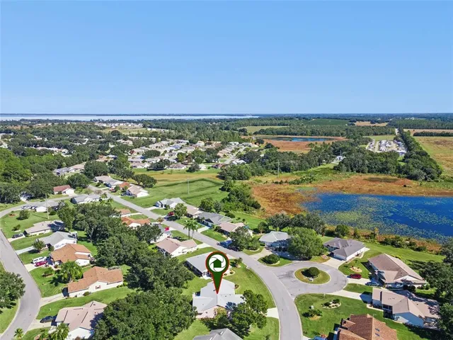 a view of swimming pool with a patio and a yard