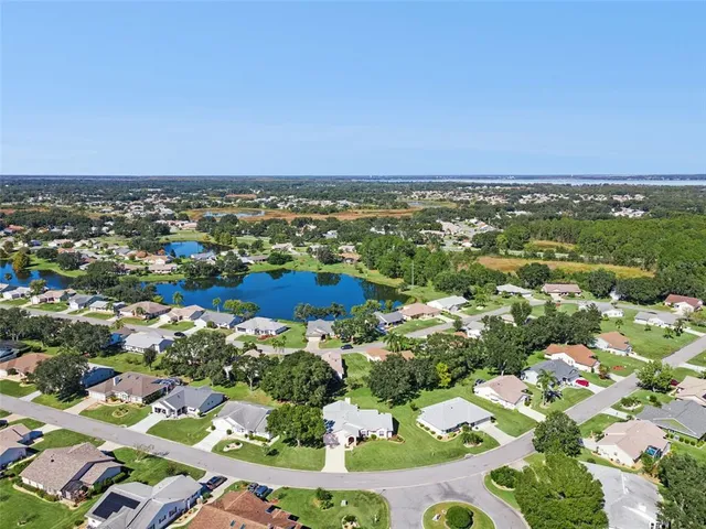 a view of a swimming pool with a yard