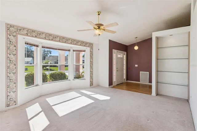 a kitchen with stainless steel appliances granite countertop a sink and cabinets with wooden floor