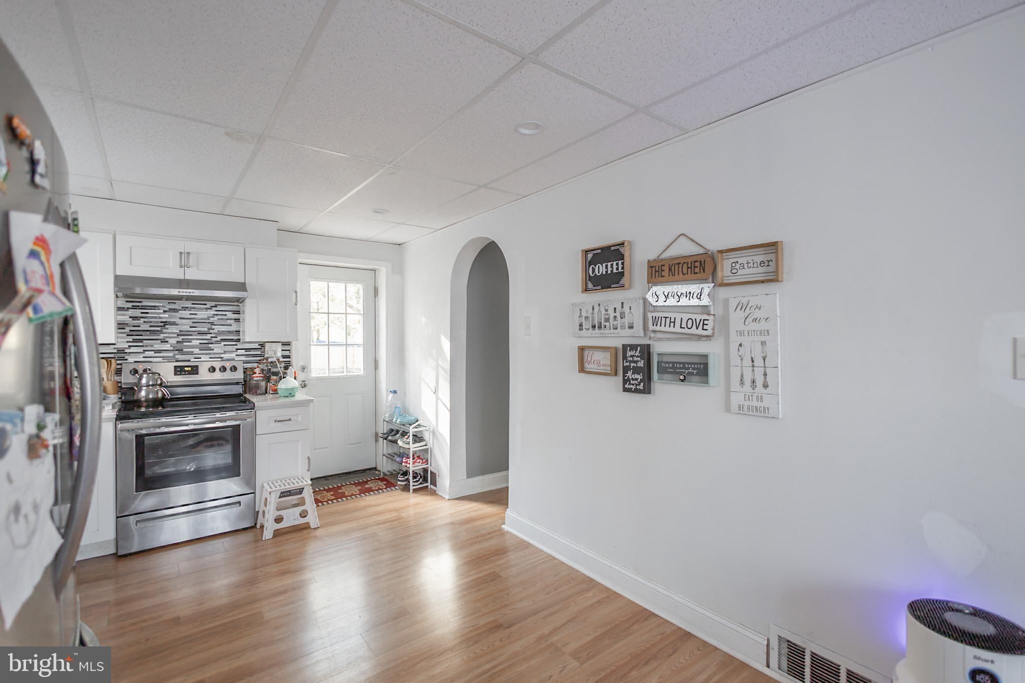 924 West Evesham Road Glendora, NJ 08029 - Photo 14 of 28 a view of a kitchen with fridge and wooden floor