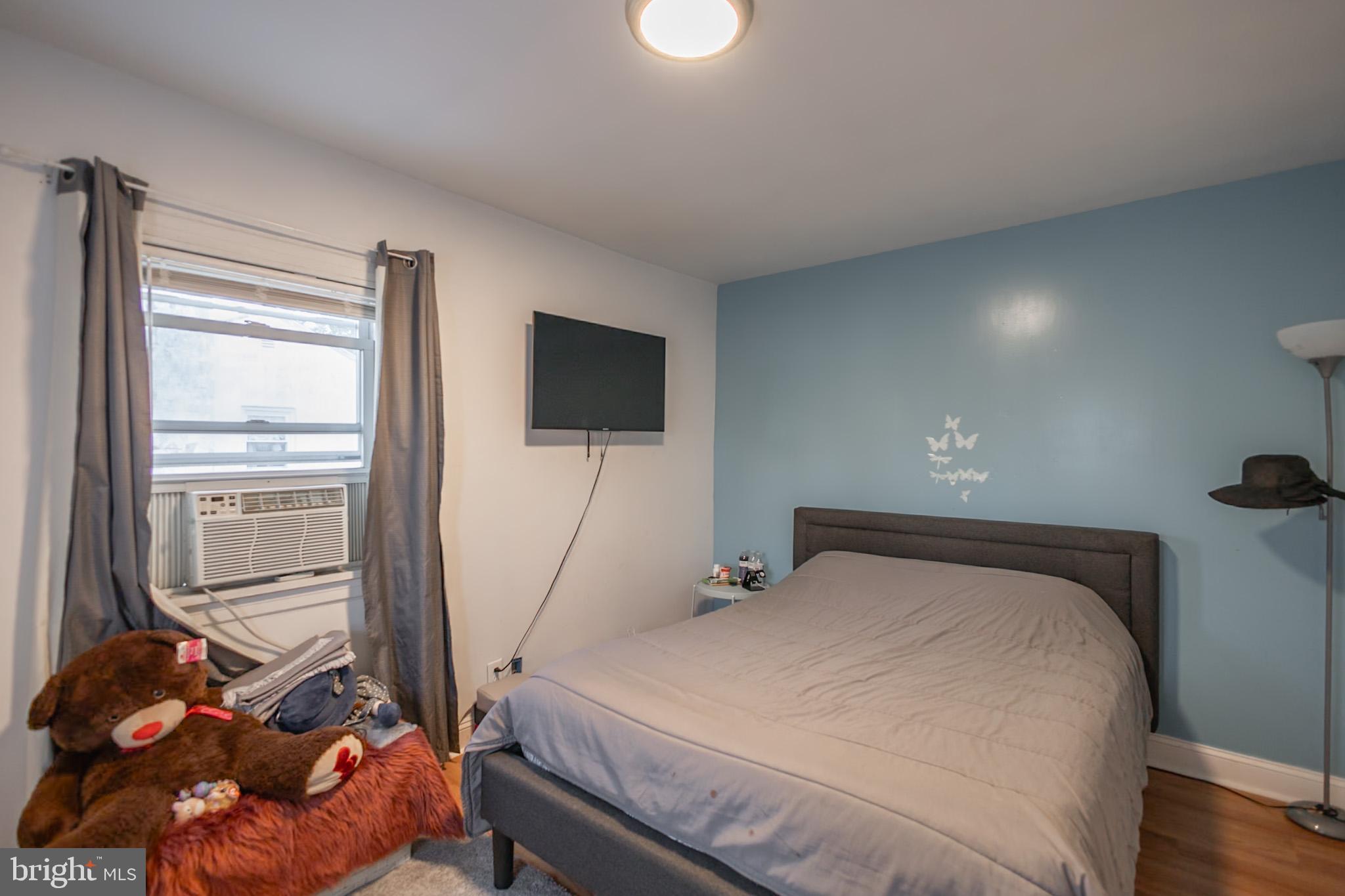 924 West Evesham Road Glendora, NJ 08029 - Photo 16 of 28 a bedroom with a bed and a flat screen tv