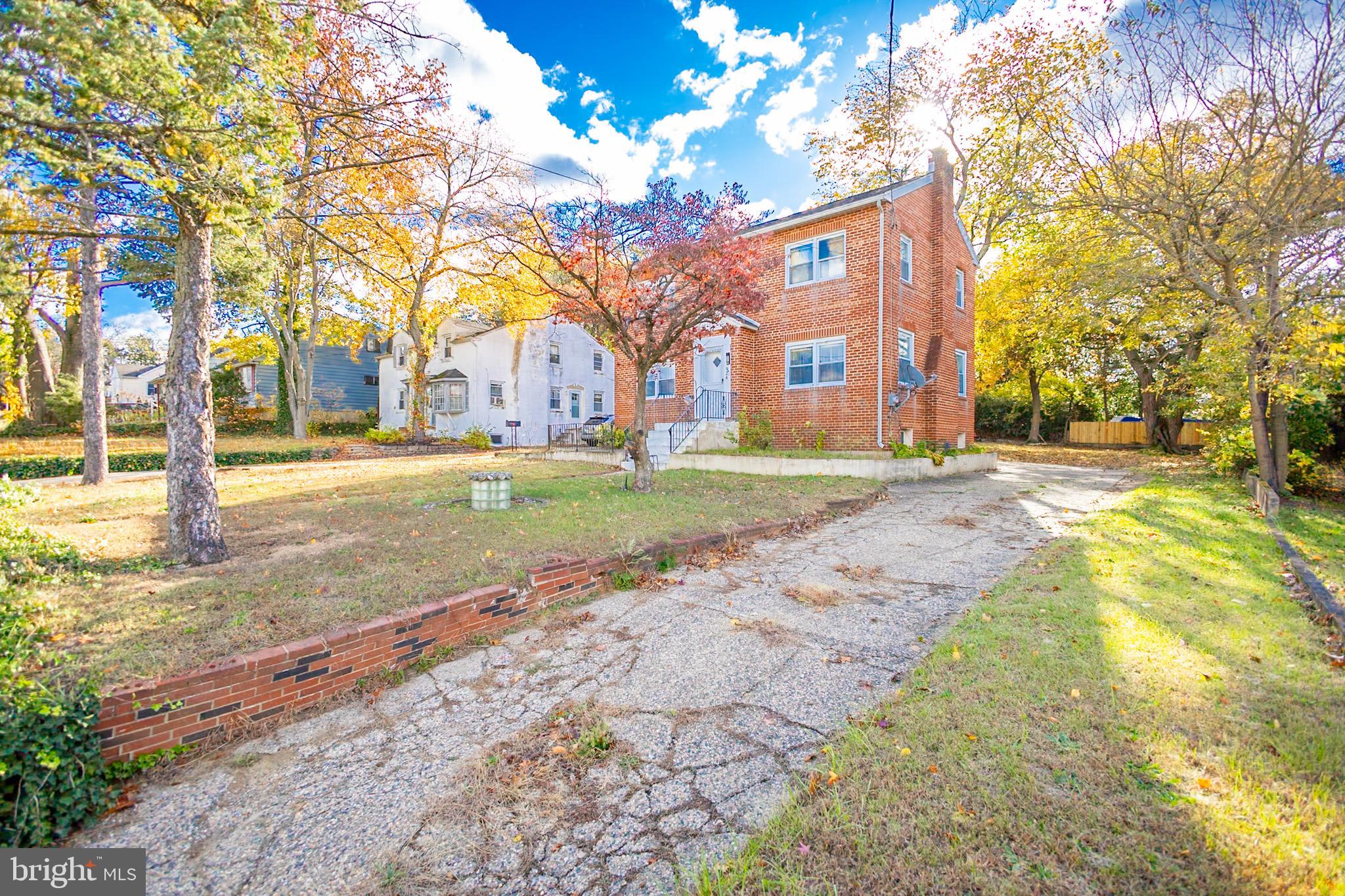 924 West Evesham Road Glendora, NJ 08029 - Photo 2 of 28 a brick building with trees in front of it