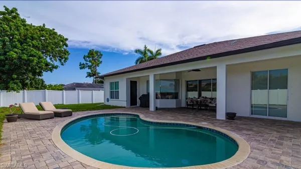 a swimming pool with outdoor seating yard and livingroom