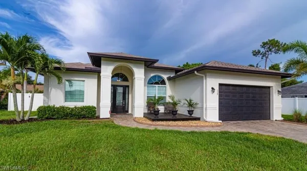 a front view of a house with a yard