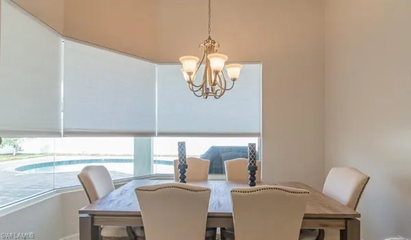 a dining room with furniture and window